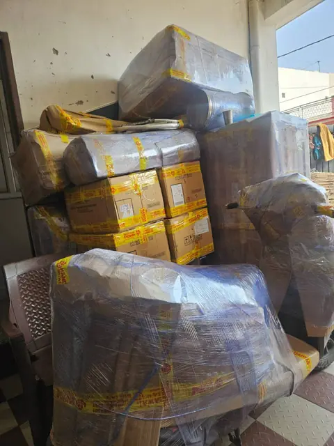 Gati household goods with furniture wrapped in protective film and sealed moving cartons